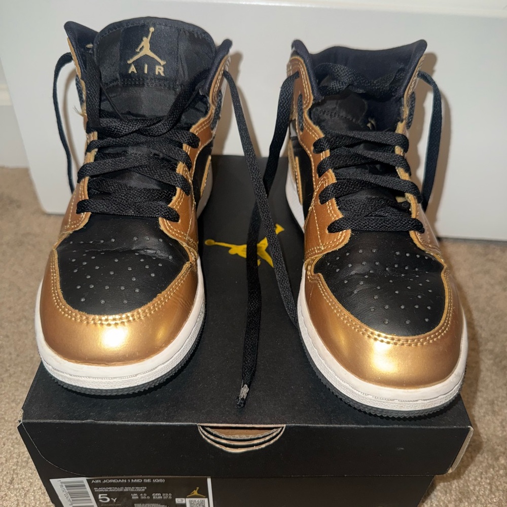 Jordan Black and Gold Retro High-Top Sneakers
